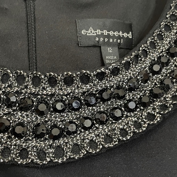 Elegant Black Sleeveless Dress with Embellished Neckline - Picture 7 of 8